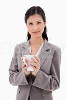 Businesswoman holding cup