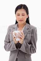 Woman enjoys the smell of her fresh coffee