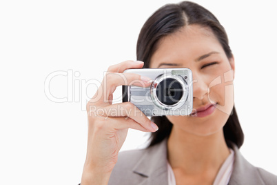 Businesswoman using camera