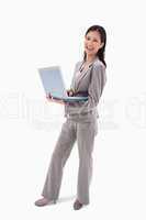 Side view of laughing businesswoman with notebook