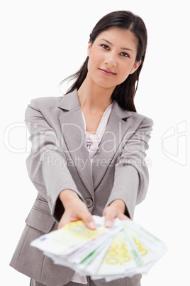 Businesswoman offering money