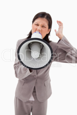 Angry businesswoman shouting through businesswoman