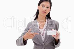 Businesswoman pointing at name badge