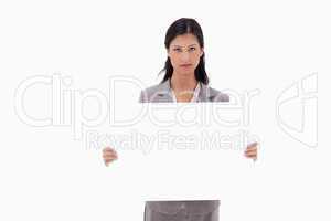 Businesswoman with blank sign board