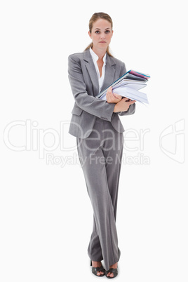 Office employee with pile of paperwork