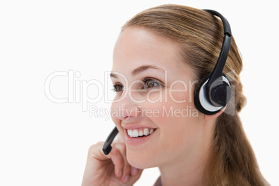 Side view of smiling call center agent