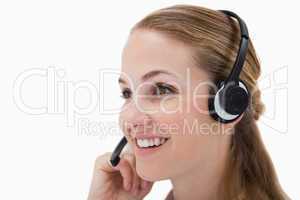 Side view of smiling call center agent