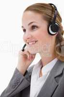 Side view of listening call center agent with headset on