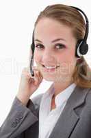 Side view of smiling female call center agent