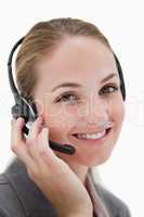 Happy smiling call center agent at work