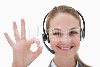 Smiling call center agent approving