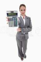 Bank employee showing her hand calculator