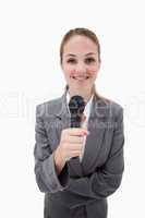 Smiling woman holding microphone