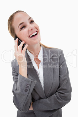 Laughing bank employee on her cellphone