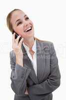 Laughing bank employee on her cellphone