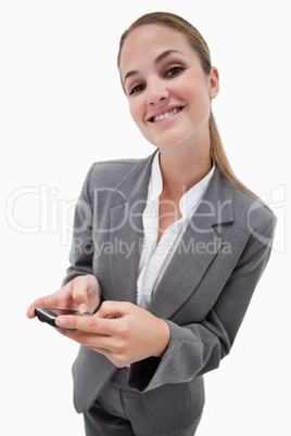 Portrait of a smiling businesswoman using a smartphone