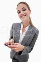 Portrait of a smiling businesswoman using a smartphone