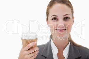 Businesswoman holding a takeaway coffee