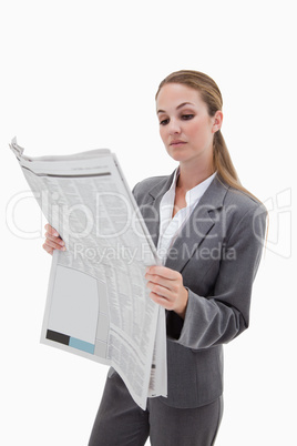 Portrait of a businesswoman reading the news