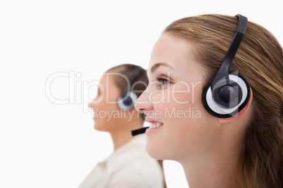 Side view of operators using headsets