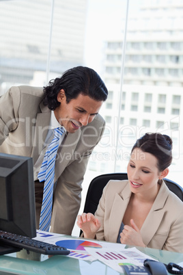 Portrait of a smiling business team making a market research