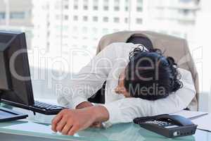 Businessman sleeping on his desk