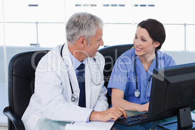 Medical team working with a computer