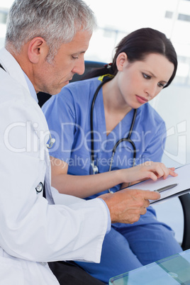 Portrait of a medical team looking a document