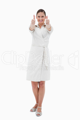 Portrait of a casual businesswoman with the thumbs up