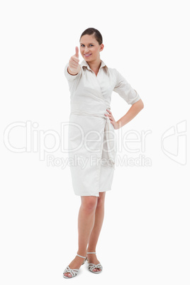 Portrait of a casual businesswoman with the thumb up