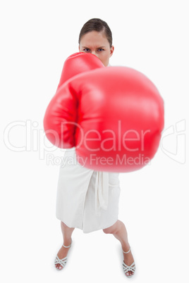 Portrait of an angry boxing businesswoman