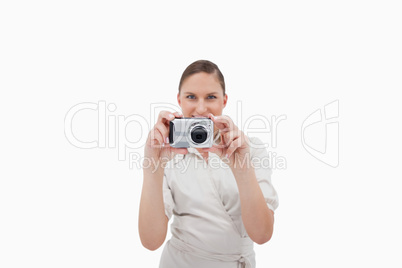 Smiling businesswoman taking a picture