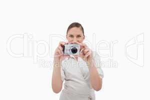 Smiling businesswoman taking a picture