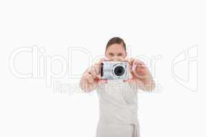 Young businesswoman taking a picture