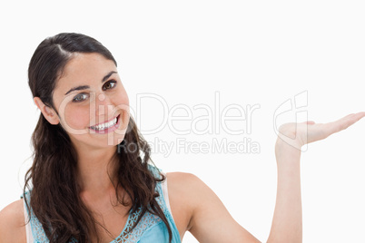 Smiling woman displaying a copy space