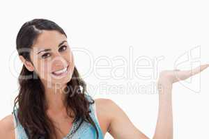 Smiling woman displaying a copy space