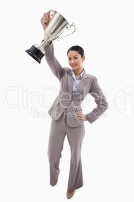 Portrait of a businesswoman showing a cup