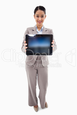 Portrait of a businesswoman showing a tablet computer