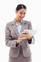 Portrait of a smiling businesswoman using a tablet computer