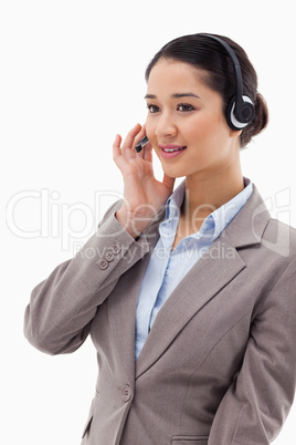 Portrait of a focused operator posing with a headset