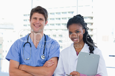 Happy doctors standing up