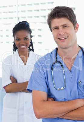 Portrait of happy doctors standing up