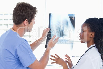 Young doctors looking at a of X-ray