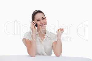 Smiling businesswoman speaking on the phone