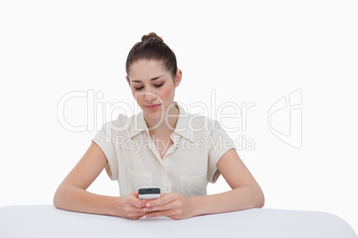 Businesswoman writing a text message