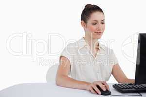 Young businesswoman using a monitor