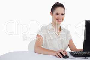 Cute businesswoman using a monitor