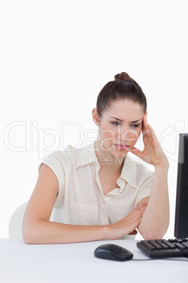 Portrait of an exhausted businesswoman using a computer