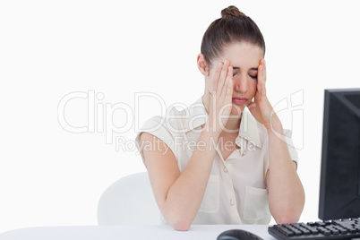 Worried secretary using a computer