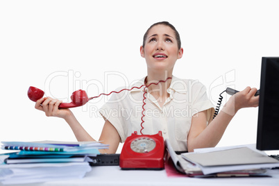 Stressed secretary answering the phones